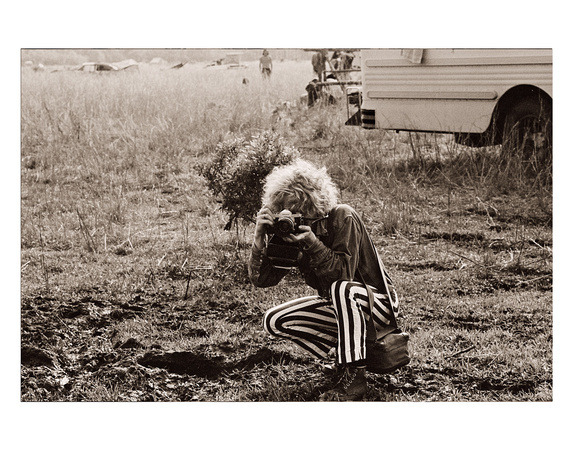 photographer-with-striped-bell-bottoms - Winter's End Festival
